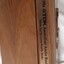 Wooden cassette box with title of award and name of book on spine
