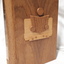 Wooden cassette box with title of award and name of book on spine and wooden picture of person reading a book