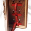 Inside of wooden cassette box with red straps