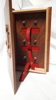 Inside of wooden cassette box with red straps