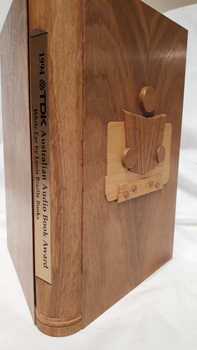 Wooden cassette box with title of award and name of book on spine