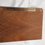 Wooden cassette box with title of award and name of book on spine