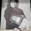 Brochure showing image of woman holding videomatic