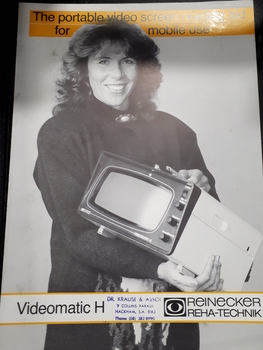 Brochure showing image of woman holding videomatic