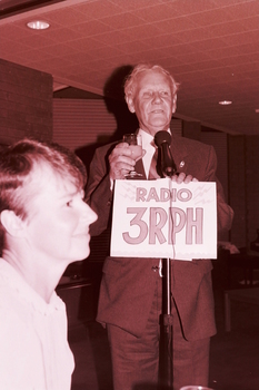 Arthur Wilkins proposes a toast at the microphone