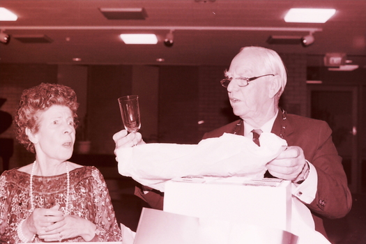 Janet and John Wicking looking at the glassware gifts