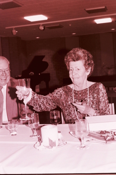 Janet and John Wicking looking at the glassware gifts
