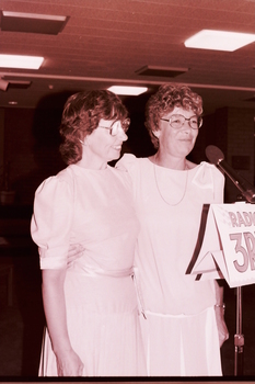 Two women addressing the audience