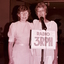 Two women addressing the audience