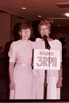 Two women addressing the audience