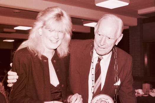 Blonde woman and John Wicking at his farewell