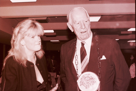 Blonde woman and John Wicking at his farewell