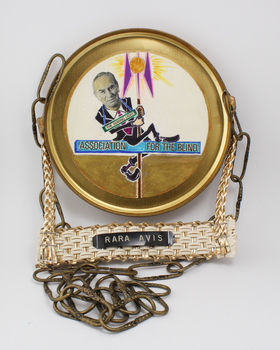 Metal plate with chain attached and photocopied image pasted to front