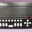 Black rectangular box with seven braille keys, five directional keys and eight command keys in light gray