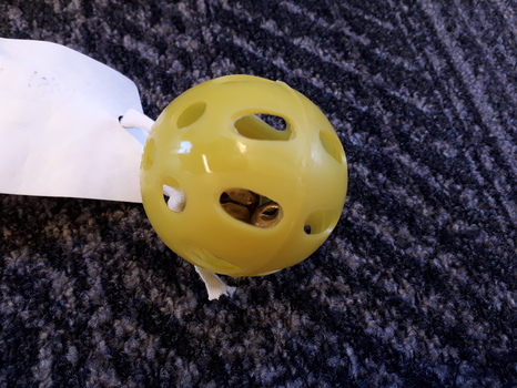 Yellow plastic ball with metal bell inside