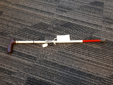 Four metal pieces with rubber tip and wooden handle