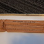 White metal cane and brown paper packet with labelling