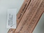 Paper packet and tag attached for exhibition