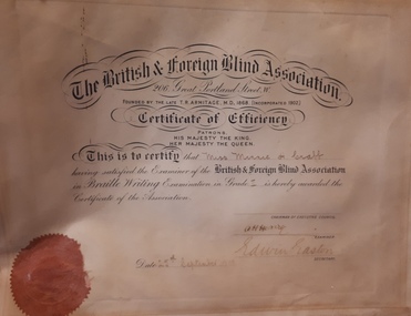 White paper with black writing and red seal in corner