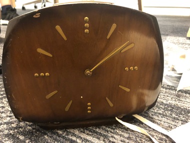 Wooden clock with metal hands and markings