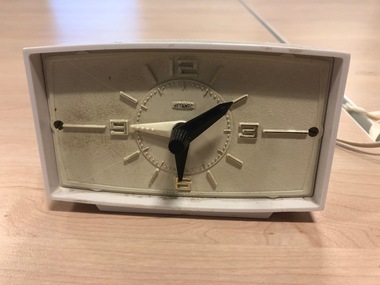 White clock with large numbers and tactile markers