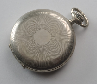 Silver fob watch with patterned cover