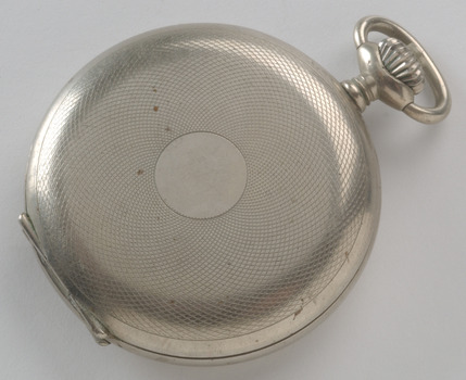 Silver fob watch with patterned cover