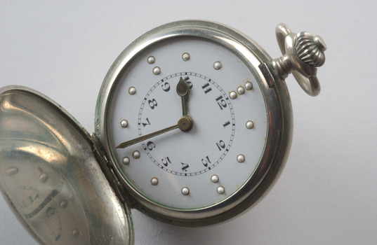 Open silver fob watch with Braille and print number display