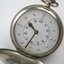 Open silver fob watch with Braille and print number display
