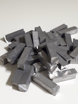 Pile of silver metal rods with square edges