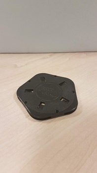Black pentagon with five round holes in each corner