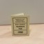 Light green or gray cardboard rectangle followed in half with "Melbourne and Metropolitan Tramways Board Blind Person's Tramway Pass 1980" in black writing