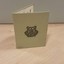 Light green or gray cardboard rectangle followed in half with Melbourne and Metropolitan Tramways Board logo on back