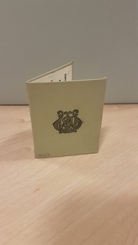 Light green or gray cardboard rectangle followed in half with Melbourne and Metropolitan Tramways Board logo on back