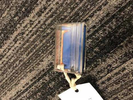Blue plastic needle threader inside clear case