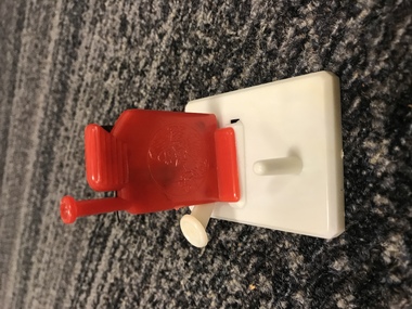 White base with red stand with embossed design