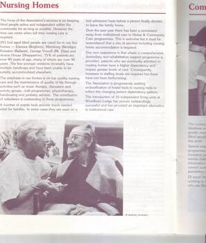Elderly woman in a bed speaks with a female who holds her hand
