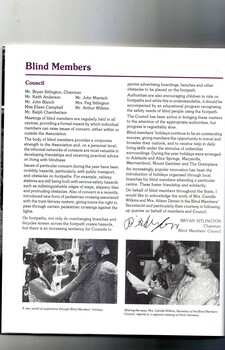 Blind woman touches a statue.  Camille Wilkins uses a microphone to report to a blind members meeting.