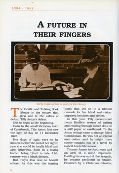 Two women in early 20th century clothing and hats, sit at a table on a verandah, hand punching Braille sheets with a frame and backboard.. 