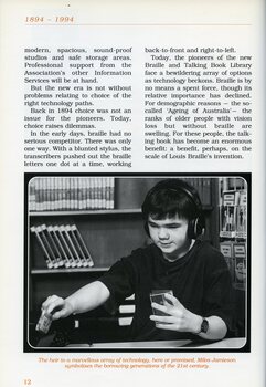 Milos Jamieson changes an audio cassette in the library.