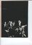 Black and white image of four children singing at Carols by Candlelight