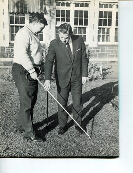 Gary Davies learns to use his long cane with the help from an instructor