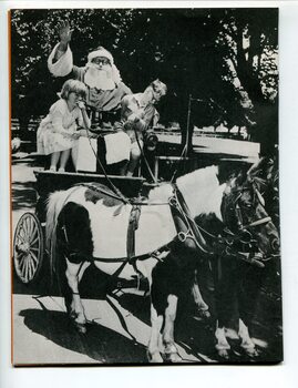 June and Alan accompany Santa on his cart ride
