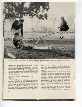 Boy and girl on a see-saw, helped by a carer