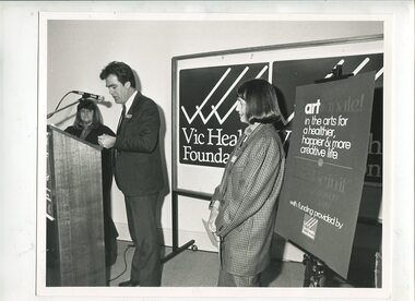 Paul Korsten speaking behind a lecturn at the Braille Book of the Year awards 1990