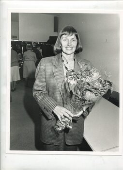 Fran Awcock holds a bunch of Australian native flowers