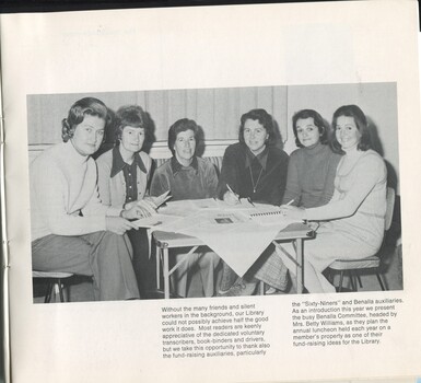 Benalla Auxiliary ladies planning their next event on a folding table