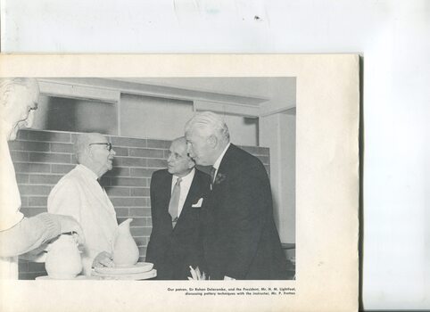 Sir Rohan Delcombe with H.M. Lightfoot discussing pottery with instructor P Fretten