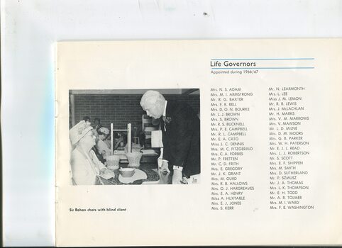 List of Life Governors and Sir Rohan Delacombe speaks with woman seated behind a table