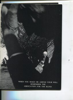 Man leaning forward with head in his hands and view of elderly woman patting a dog
